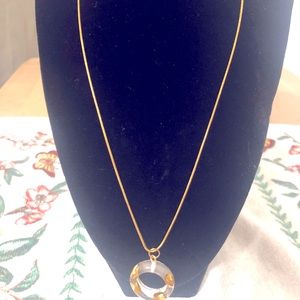 Gold Necklace With a Handmade Molding Charm.